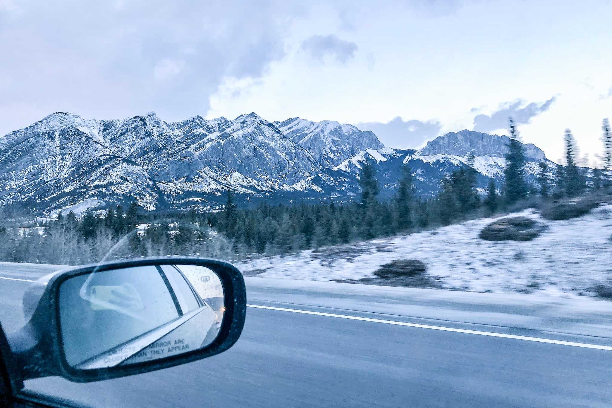 View from the car, driving through Banff National Park in winter
