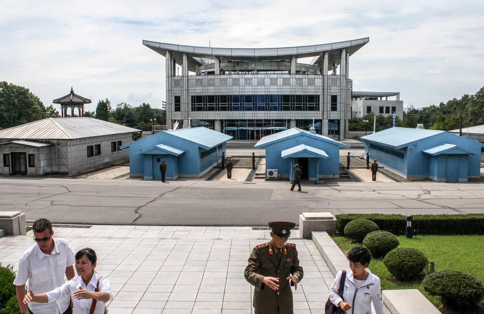 Travellers visit the DMZ on the North Korea side on a guided tour