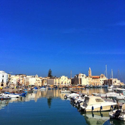 View over Trani with blue Adriatic sea and yachts