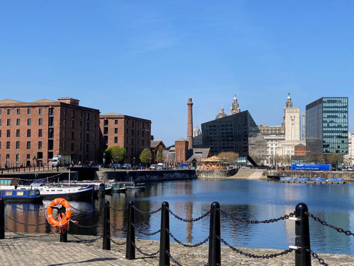 Royal Albert Dock on the left. Top of the Liver Building in the background.