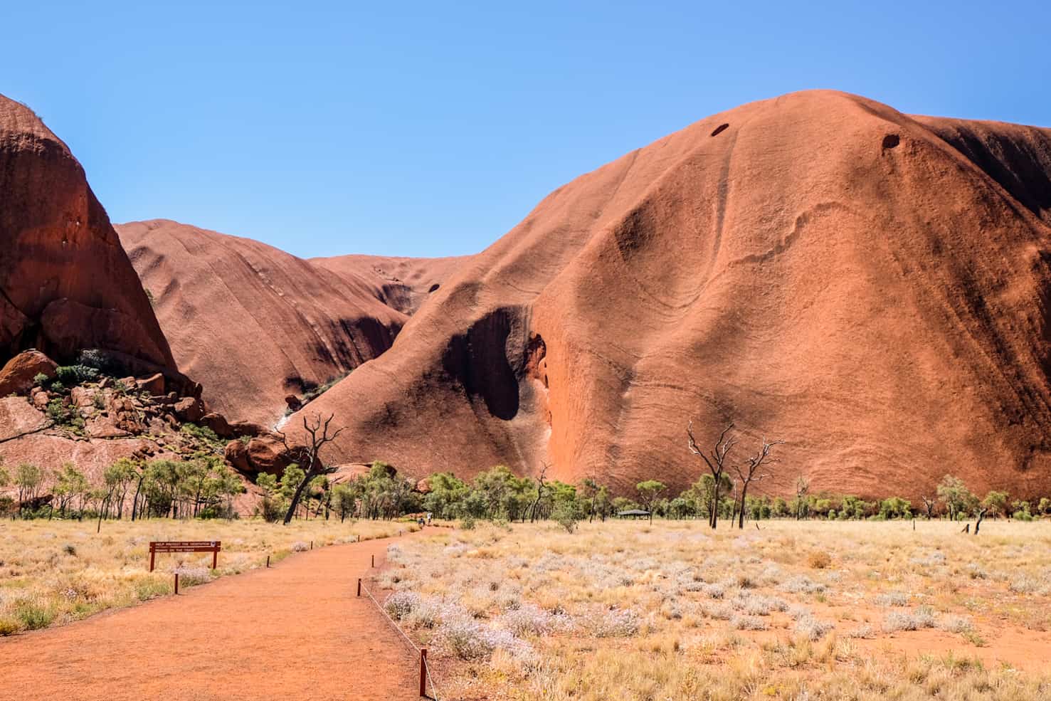 The ochre orange giant rock formations of Uluru Ayers Rock in Australia. 