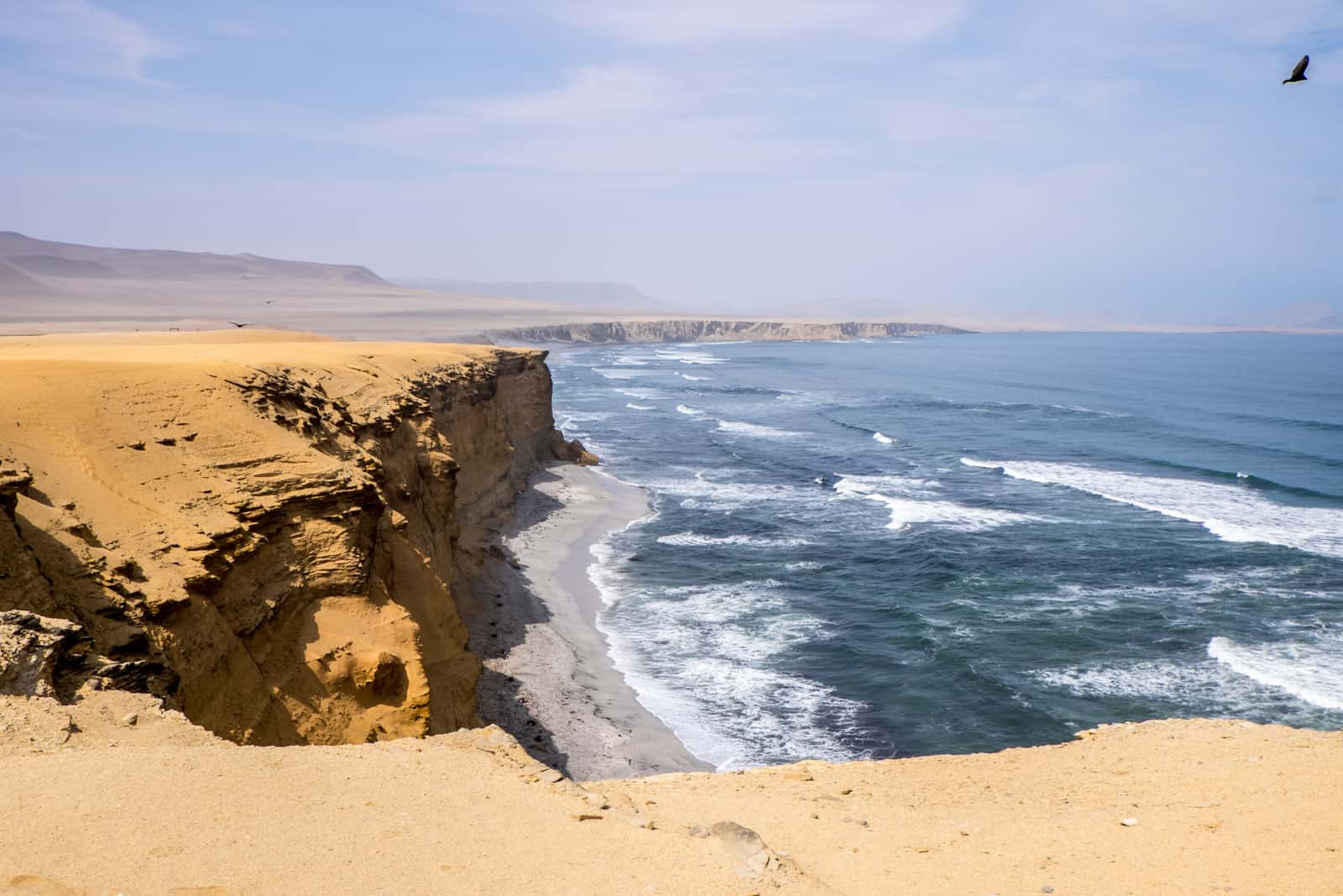 The sandy ocean oastline cliffs of the Paracas National Reserve in Peru.