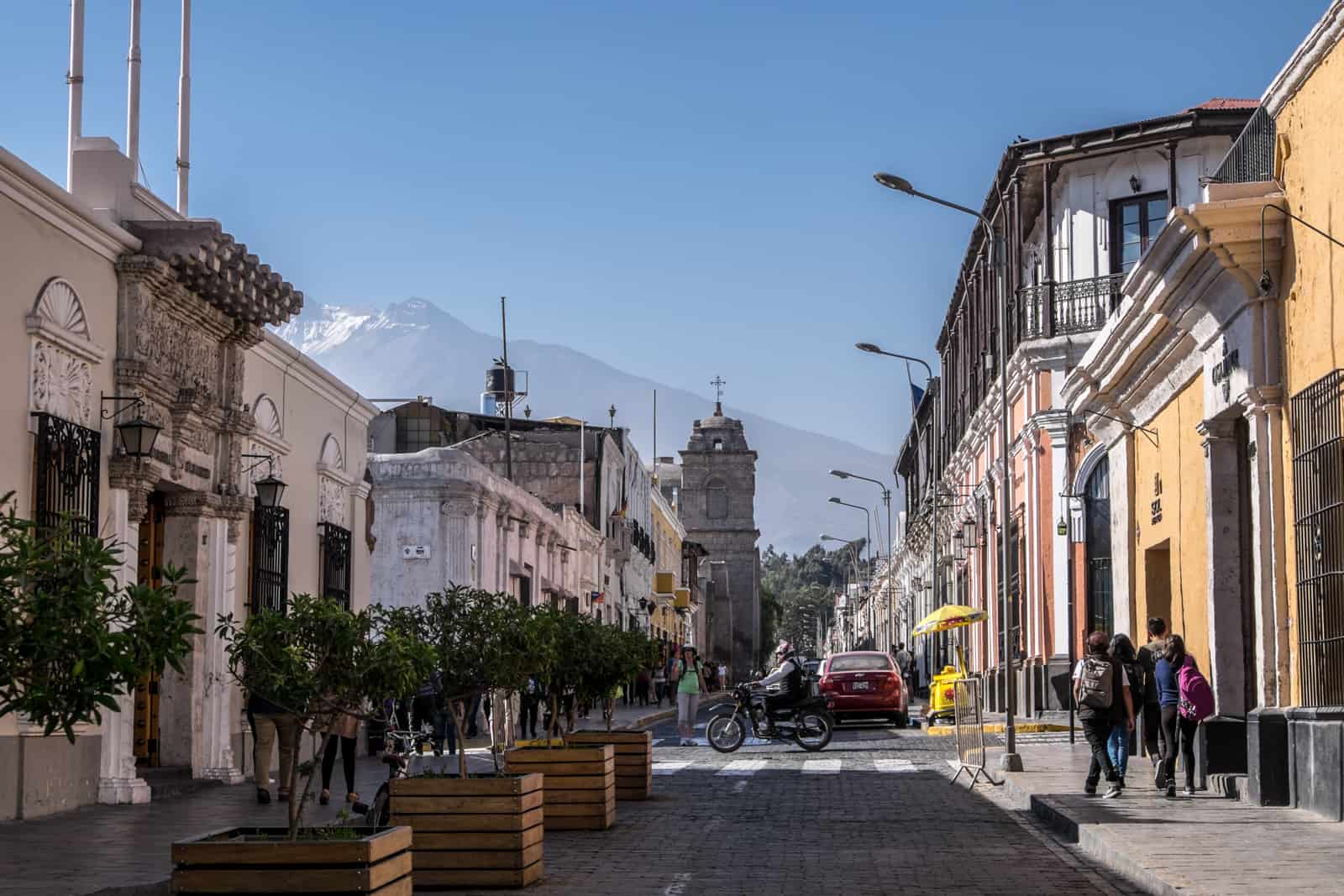 The snow-capped Misti Volcano rises behind the colourful old streets of Arequipa, Peru.