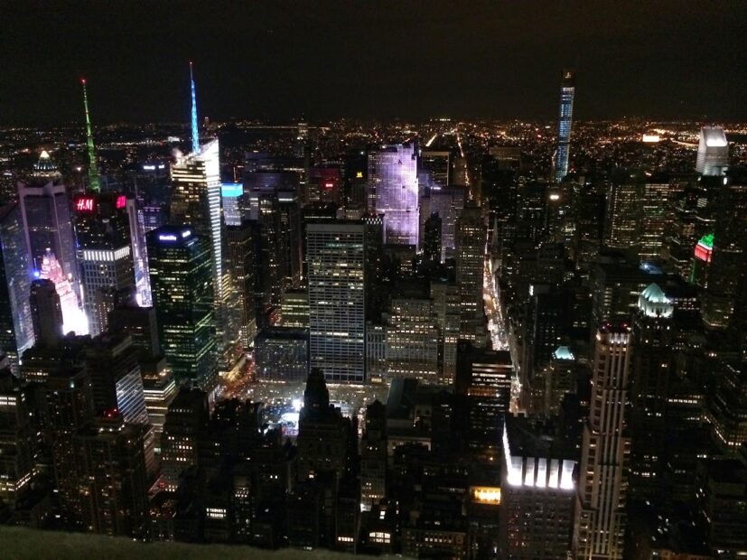 new york skyline at night as seen from the top of the empire state building