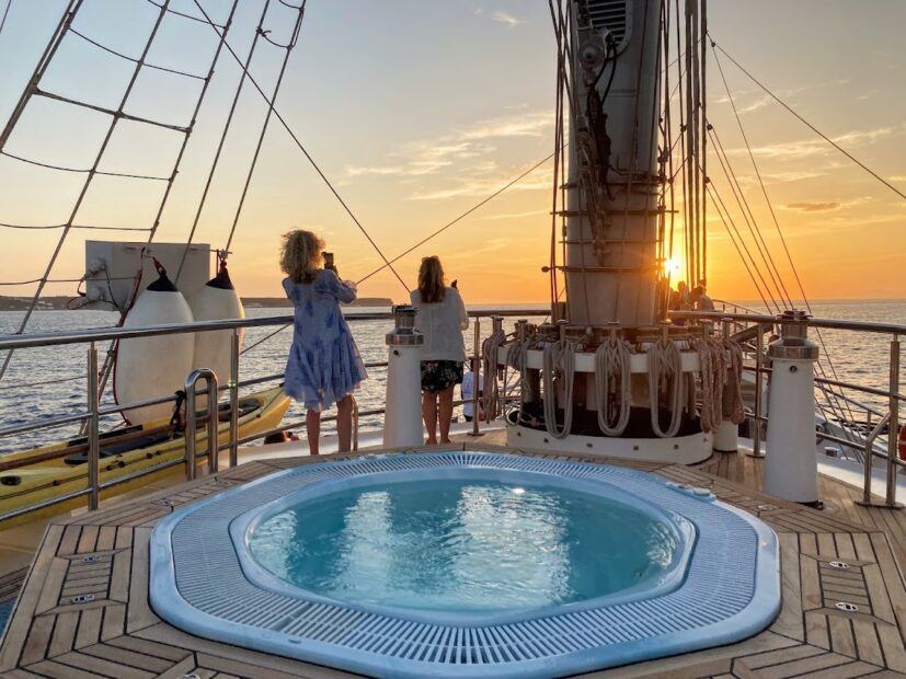 Sunset over Santorini from the sun deck on the Running on Waves cruise.