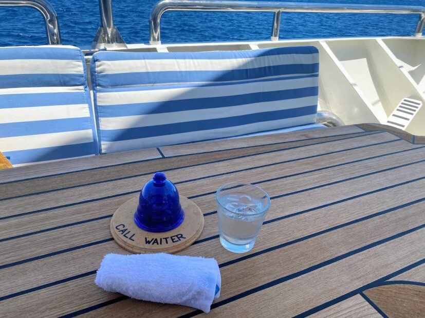 Blue call waiter bell, cold towel and iced water on Running on Waves cruise