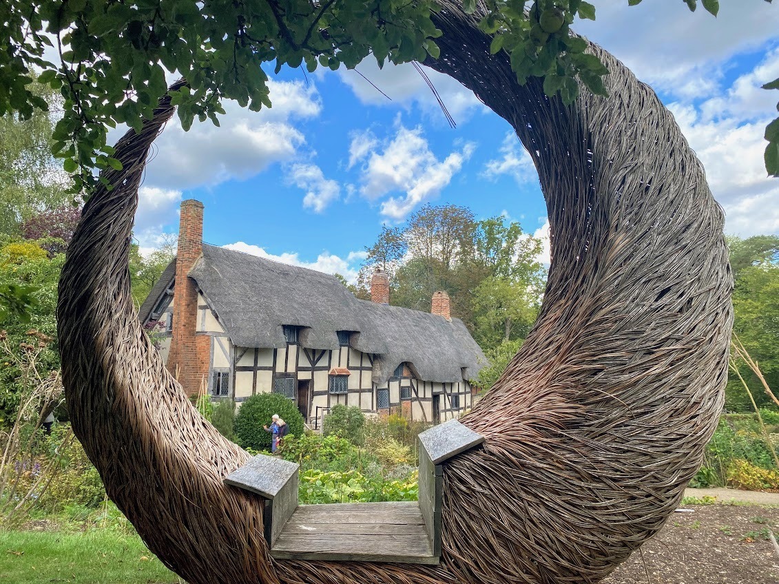 View of Anne Hathaway's cottage through a circular woven seat