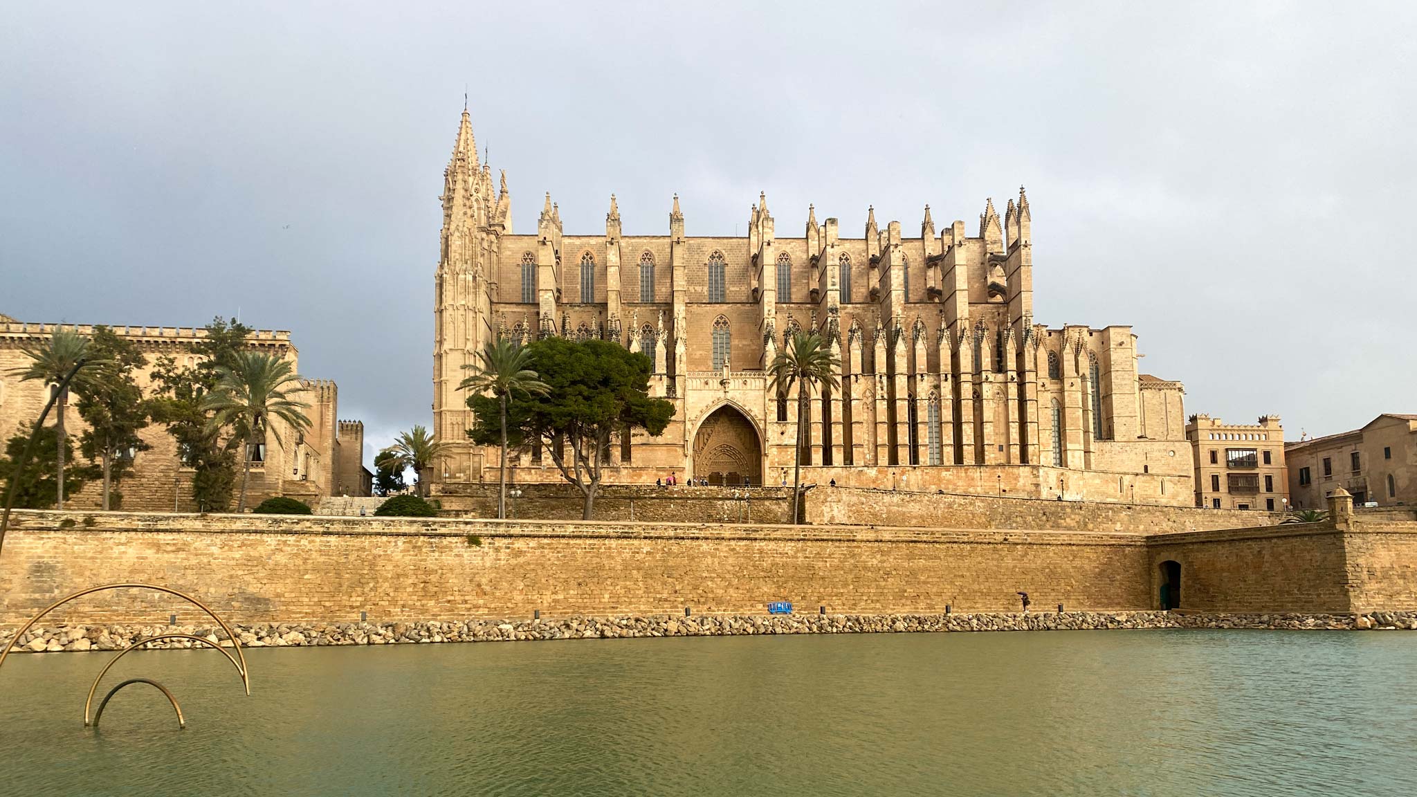 Palma Cathedral in front of the water that makes Mallorca island one of the best places to visit in Spain