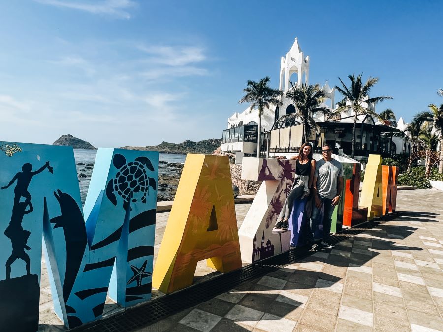 Annette and Pete Pose at the Mazatlan Sign