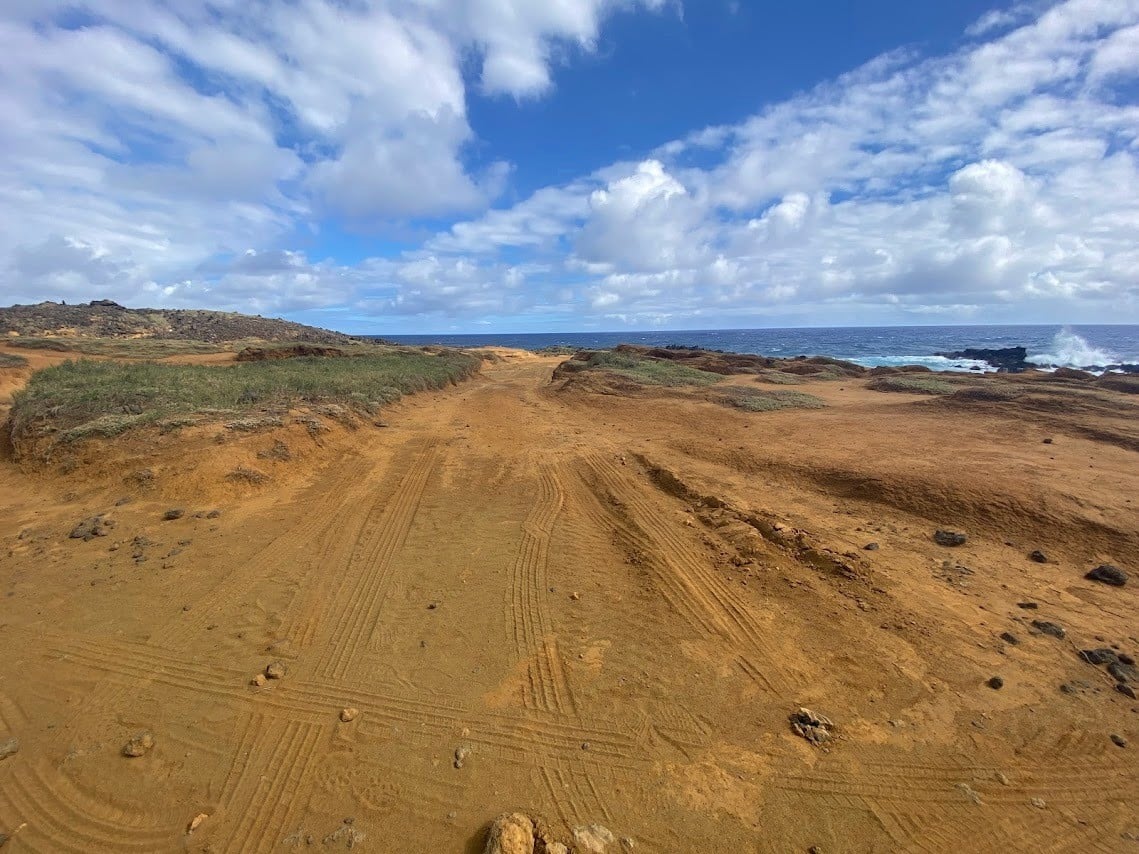 flat and sandy trail to green sand beach in Hawaii