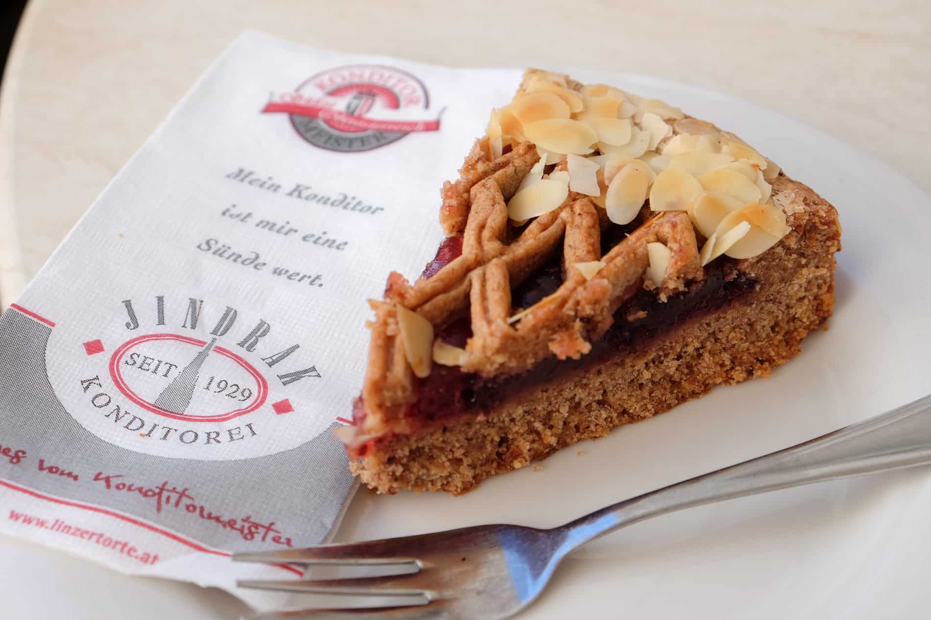 A slice of Linzer Torte with a criss-cross crust and jam filling, served in the Jindrak cafe in Linz since 1929. 