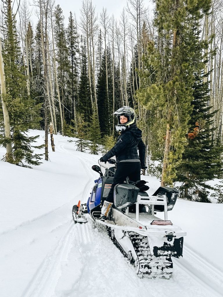 Annette enjoying the snowmobile at Vista Verde Guest Ranch Colorado