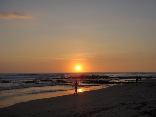 Running on the beach at sunset in Santa Teresa