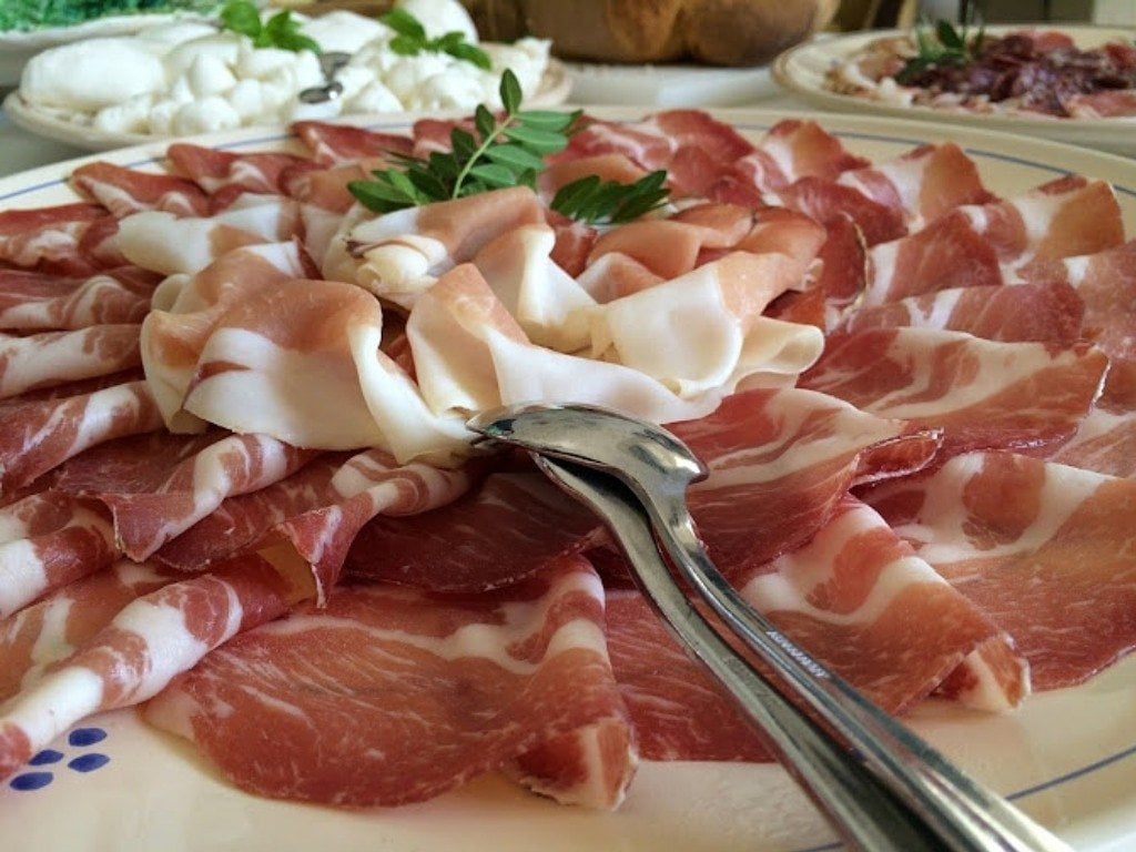 Plate of cured meats and cheese