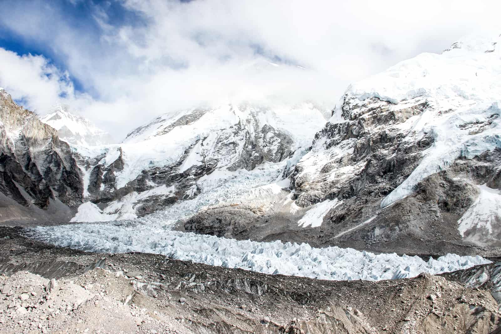 The stretch of spiky ice of the Khumbu icefall at Everest Base Camp, with Mount. Everest looking above it in the same white glow