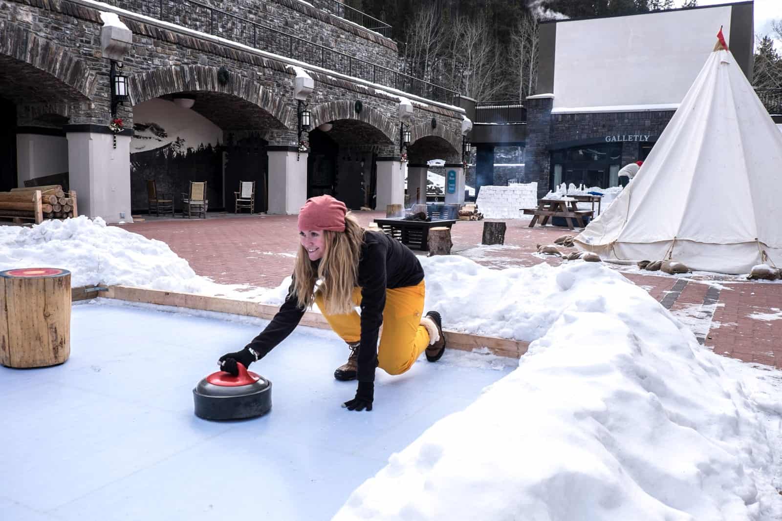 Woman tries Canadian winter sport of curling in Banff