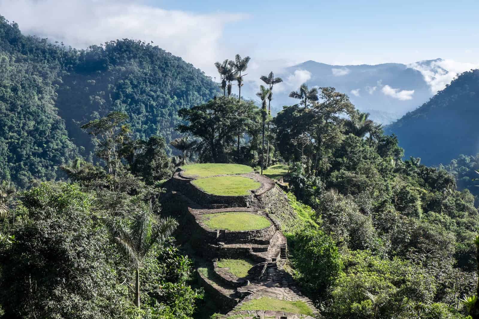 View of the grass-filled large stone terraces of the Lost City Trek Ciudad Perdida