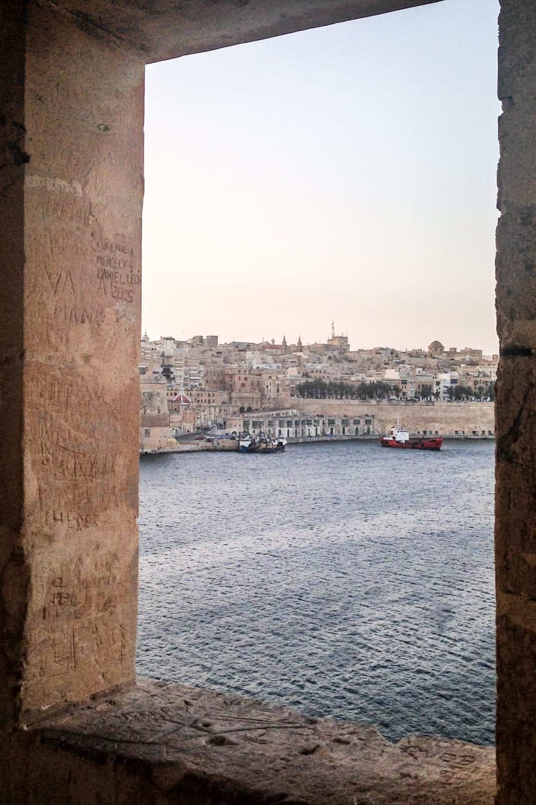 Secret Senglea rock window viewpoint in Malta with a view to Valletta