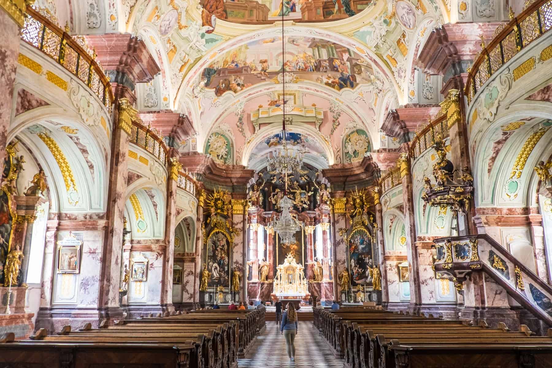 The baroque gold, brown and pastel painting decorated interior of the basilica at Stift Rein Abbey in Styria Austria
