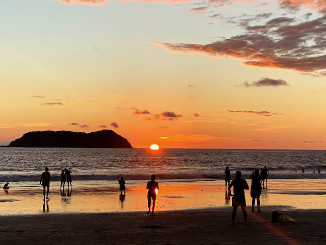 orange sunset over the beach in manuel antonio costa rica