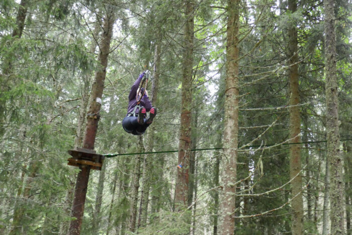 ziplining through the forest