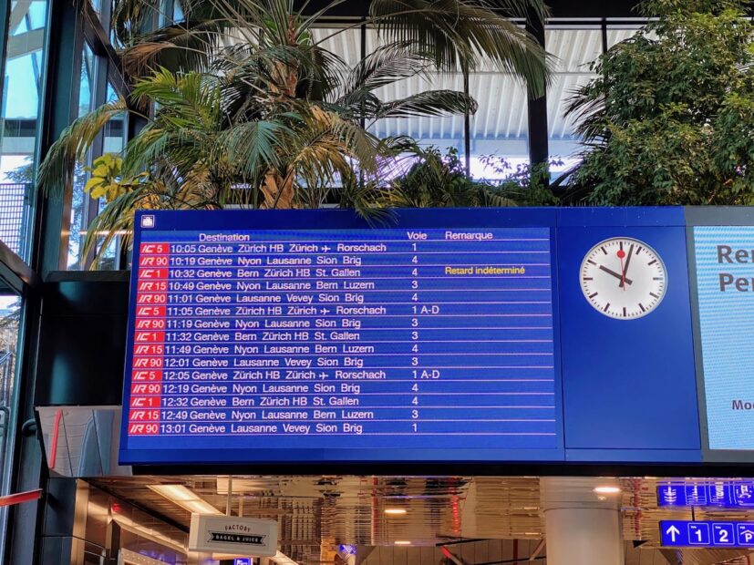 Board showing train schedule within Geneva Airport