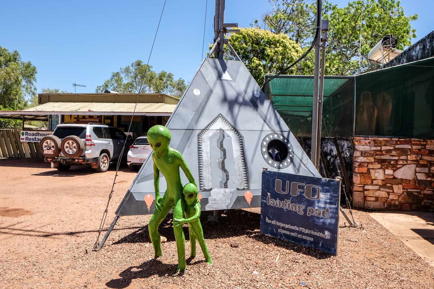 Model of two green aliens as a silver triangle spaceship in the Northern Territory town of Wycliffe Well. 