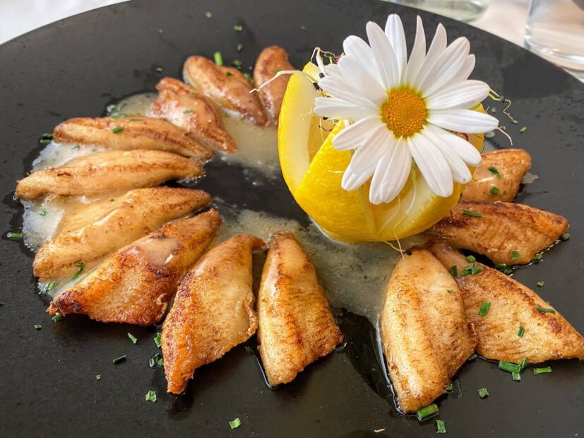 Le Giétroz in le chable fish dish decorated with a lemon and flower
