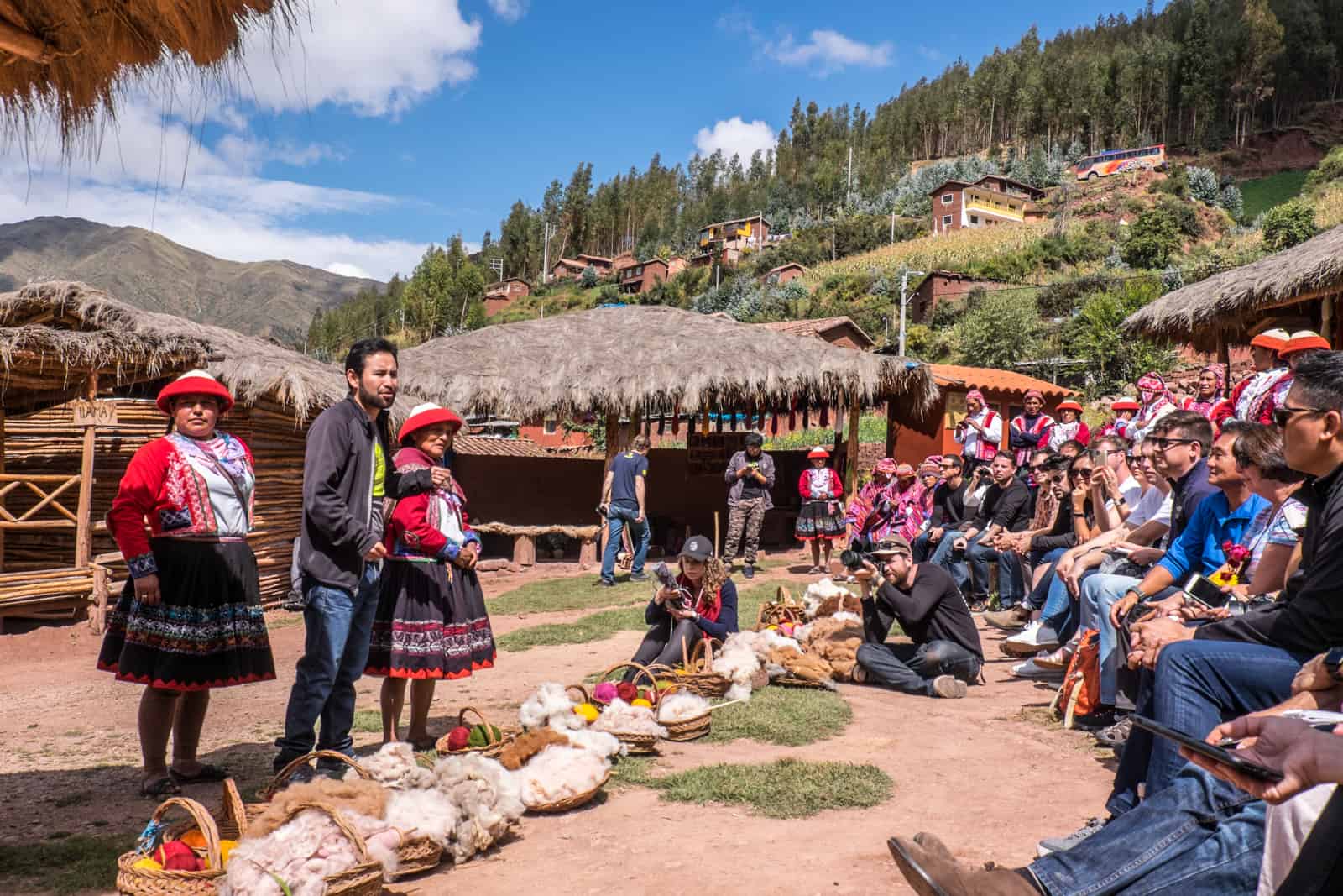 A Peru tour group visiting the village of the Ccaccaccollo Women’s Weaving Co-op in the Sacred Valley, Peru. 