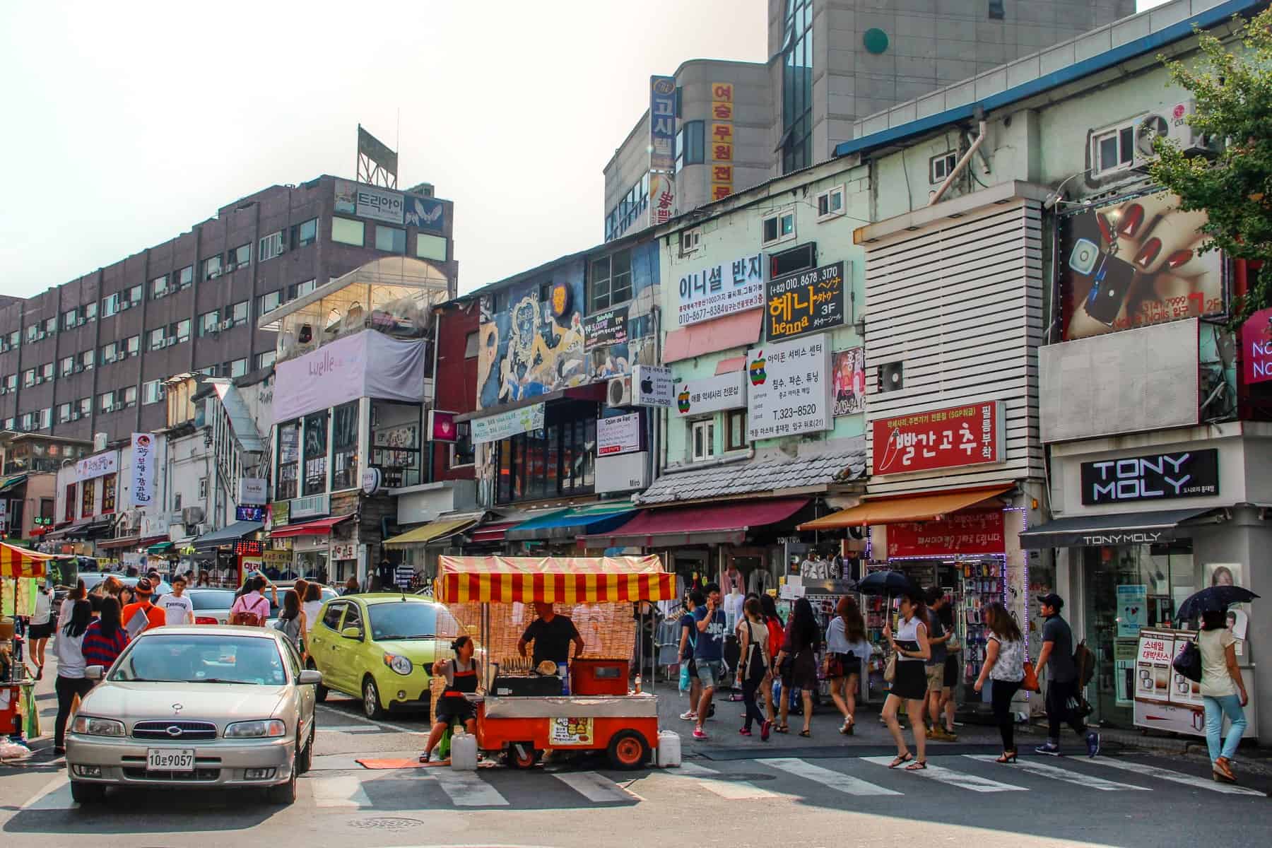 Locals at a busy street of Namdaemun Market in Seoul, South Korea.