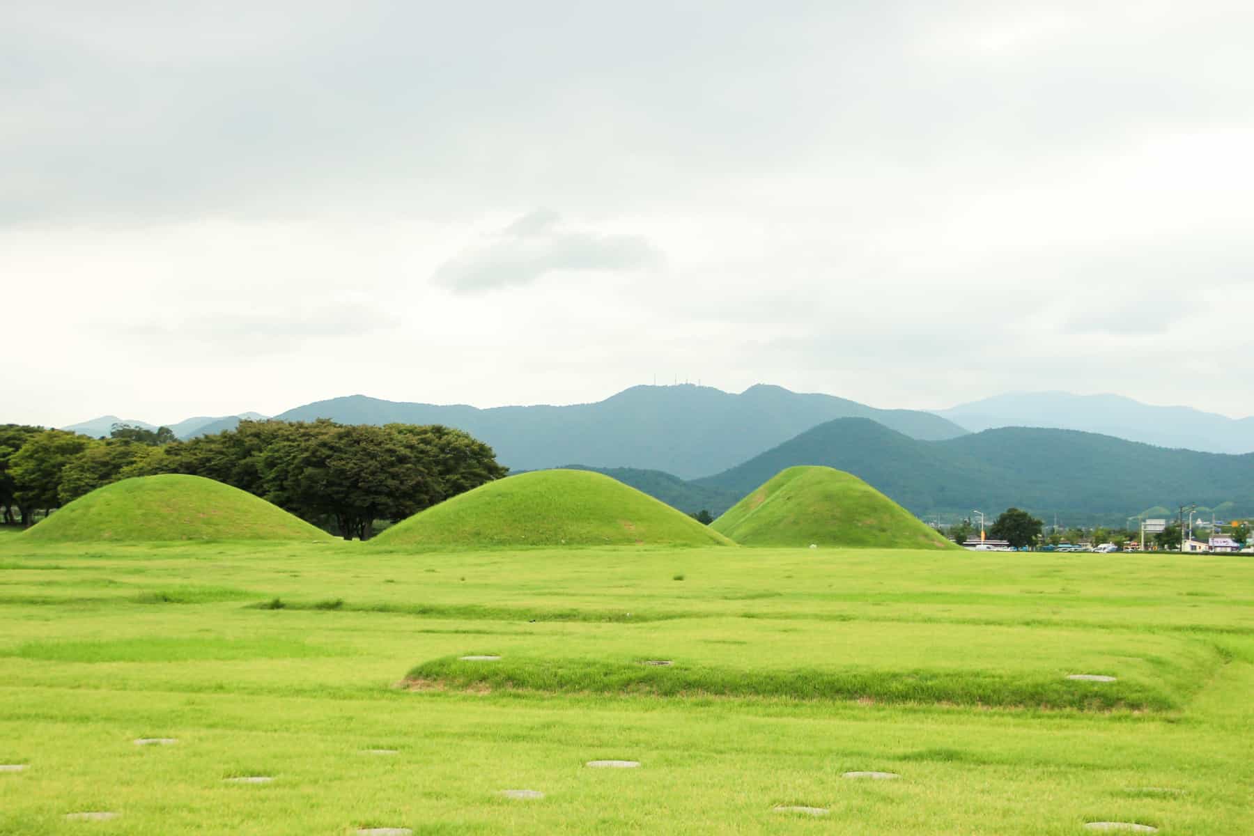 Three grassy mounds in Gyeongju - one of the best places to visit in Korea. 