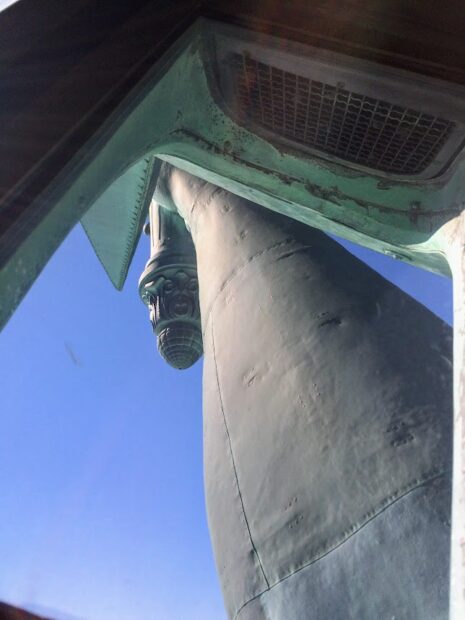 close up of the statue of liberty arm seen from inside the crown