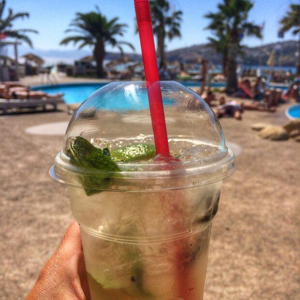 iced cocktail with a straw at a beach club in Ios Greece