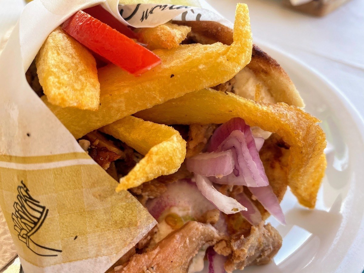 Greek gyros wrap of meat, pita, fried and salad